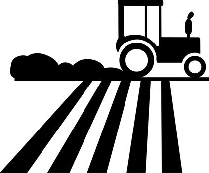 Silhouette of a tractor running on the field which causes dust.