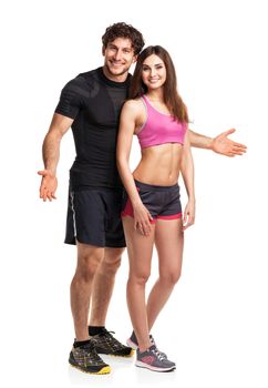 Sport couple - man and woman after fitness exercise on the white background