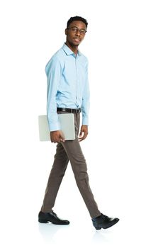 Happy african american college student with laptop standing on white background