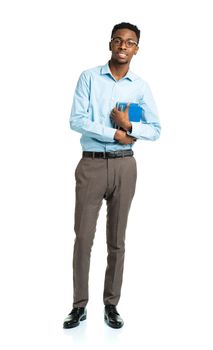 Happy african american college student with books in his hands  standing on white background