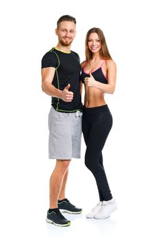 Athletic man and woman after fitness exercise with a finger up on the white background