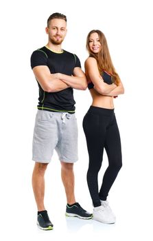 Sport couple - man and woman after fitness exercise on the white background