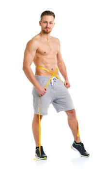 Sport man with measuring tape on the white background