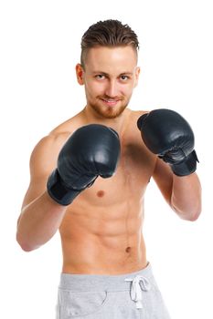 Athletic attractive man wearing boxing gloves on the white background