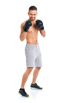 Athletic attractive man wearing boxing gloves on the white background