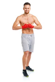 Athletic attractive man wearing boxing bandages on the white background