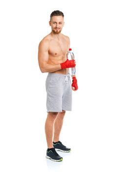 Sport attractive man wearing boxing bandages with bottle of water on the white background