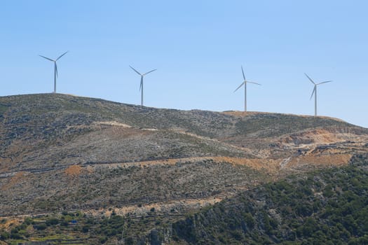 A wind mill farm on top of the mountain