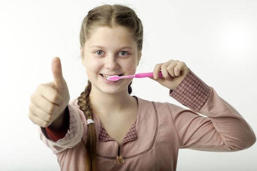 Cute girl brushing teeth isolated on white