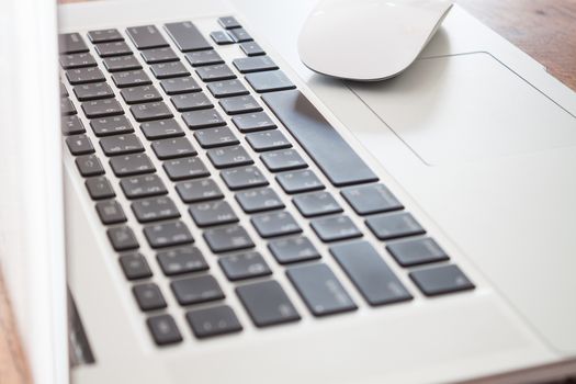 Close up of white labtop with mouse, stock photo