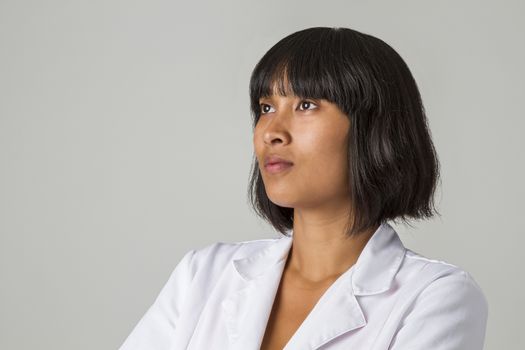 portrait of a twenty something philipino doctor  against white background