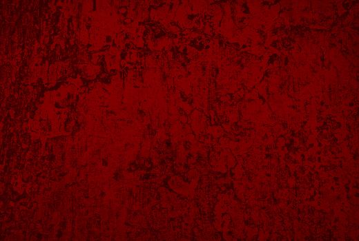 texture of a dilapidated wall in a red tone
