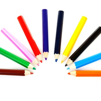 Colorful pencils in an circle over white background