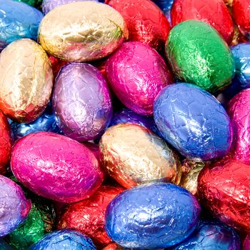 Background of colorful chocolate easter eggs in closeup