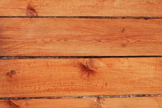 Wall made of polished wooden slats  covered with a varnish