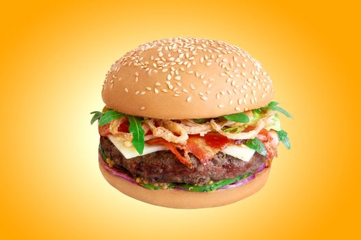 Fresh hamburger isolated on yellow background