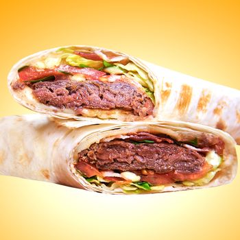 Pita - grilled meat and vegetables isolated on yellow background