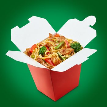 Wok noodles box with chopsticks  isolated on white background