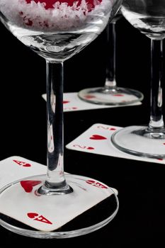 playing card below a glass