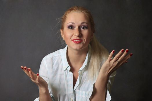 Beautiful young blond woman portrait in studio