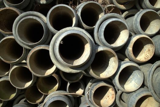 Irrigation pipes piled up in waiting summer time