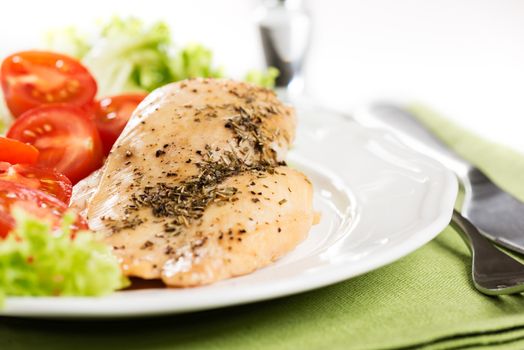 Chicken meet with tomatoes in plate