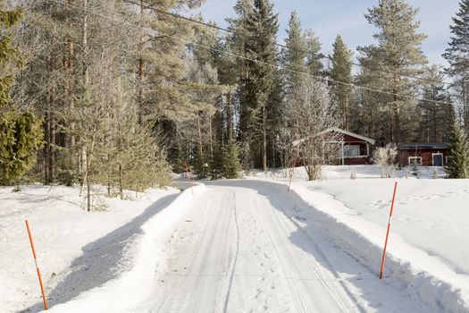 Winter Road to Red Swedish Cottage