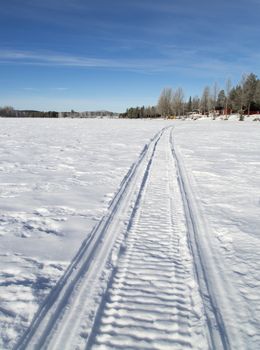 Snowmobile Tracks on Frozen Lake
