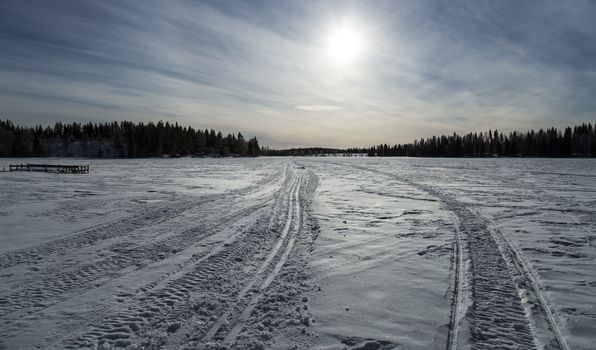Tracks on Frozen Lake in Winter
