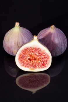 fruits of fresh figs isolated on black  background