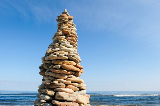 Pyramidal stack of pebbles on the coast