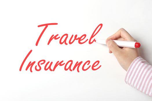 Business woman writing travel insurance word on whiteboard