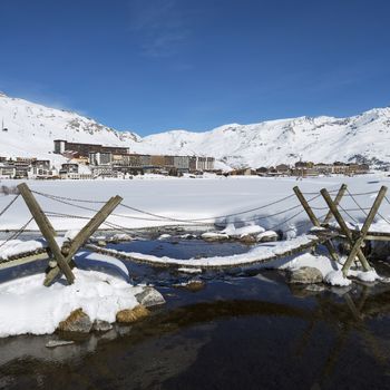 View of Tignes village with footbridge, France.