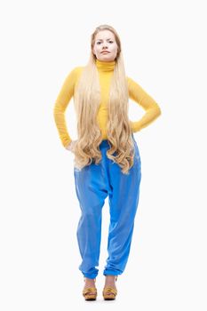 Young Woman with Long Blond Hair in Yellow Top and Blue Pants.