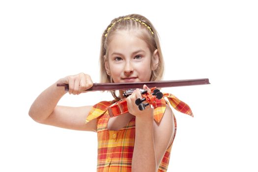 Portrait of a Little Girl Playing Toy Violin - Isolated on White