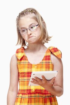 Portrait of a Little Girl with Glasses Holding Tablet - Isolated on White