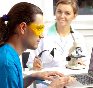 group of scientists working at the laboratory