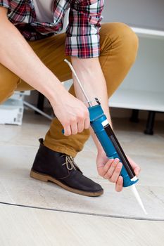 worker repairing the floor, part of body