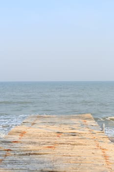 wooden pier to the sea and sky