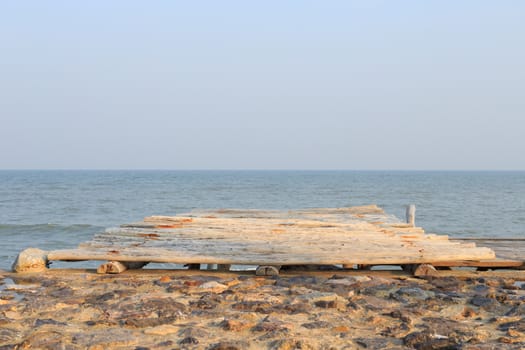 wooden pier to the sea and sky