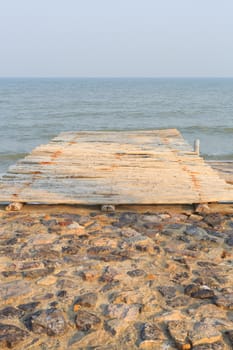 wooden pier to the sea and sky