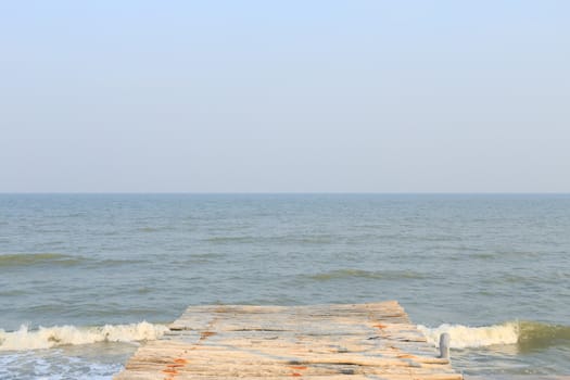 wooden pier to the sea and sky