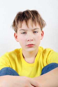 Sad and Tired Teenager on the White Background