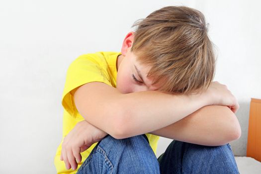 Sad Teenage Boy on the White Background