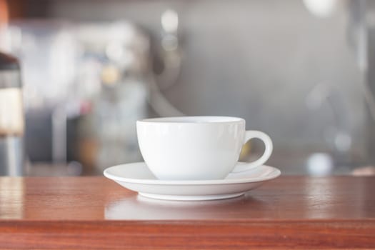 White coffee cup in coffee shop, stock photo