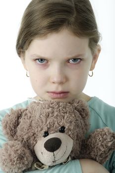 Portrait of  little girls cry holding teddy bear isolated on white
