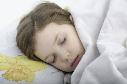 little girl sleeping in her bed