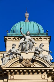 sculpture of three women on facade of juliusz slowacki theater in cracow in poland