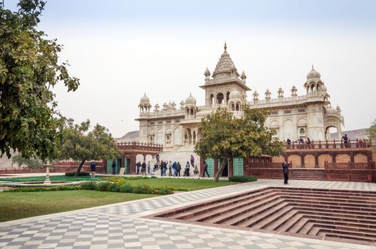 Jodhpur, India - January 1, 2015: Tourist visit The Jaswant Thada mausoleum on January 1, 2015 in Jodhpur, India. It is a white marble memorial built by Maharaja Sardar Singh of Jodhpur State in 1899 in memory of his father, Maharaja Jaswant Singh II.