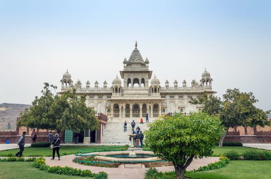 Jodhpur, India - January 1, 2015: Tourist visit The Jaswant Thada mausoleum on January 1, 2015 in Jodhpur, India. It is a white marble memorial built by Maharaja Sardar Singh of Jodhpur State in 1899 in memory of his father, Maharaja Jaswant Singh II.